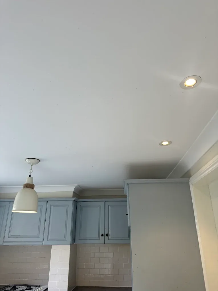 Downlights installed in a kitchen with blue cabinetry