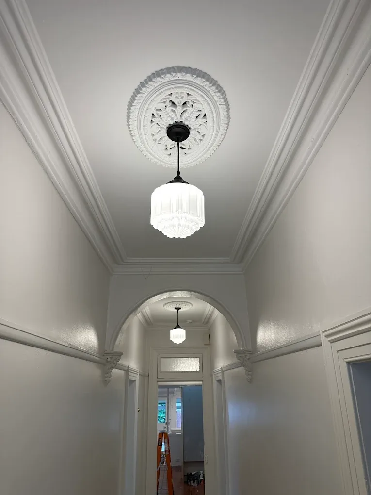 Heritage hallway with restored pendant lighting installed by SwitchConnect Electrical