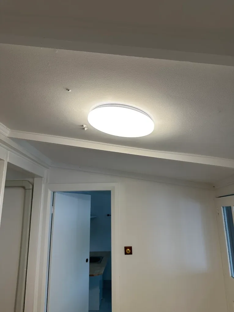 New LED oyster light installed on ceiling